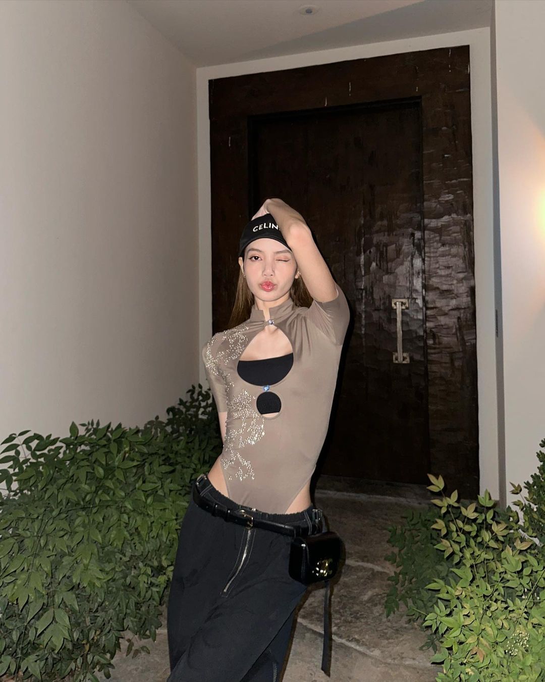 LISA FROM BLACKPINK WEARS THE DAISY BODYSUIT IN TOBACCO BROWN