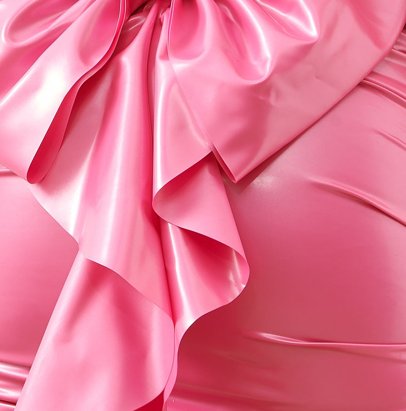 CLOSE UP OF THE PINK LATEX FABRIC DETAIL