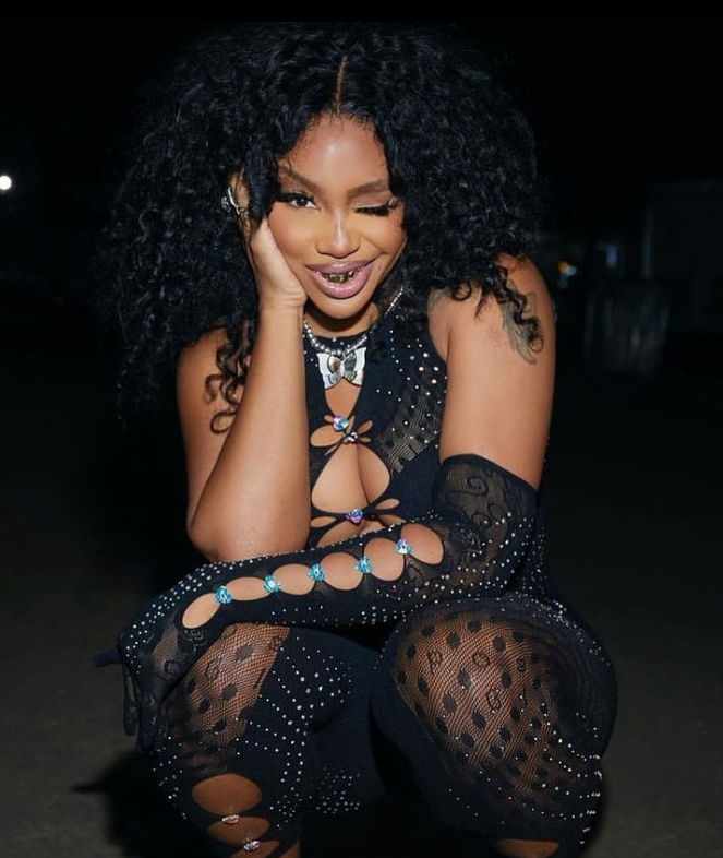 SZA WEARS THE RHINESTONED JANICE JUMPSUIT IN BLACK ALONG WITH THE RHINESTONED GRACIE GLOVES IN JET BLACK